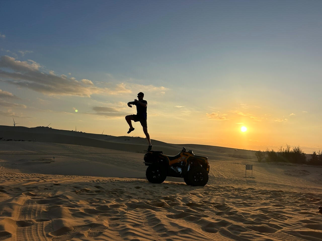 self-ride atv Mui ne Travelers riding self-drive ATV on the Mui Ne sand dunes at sunrise